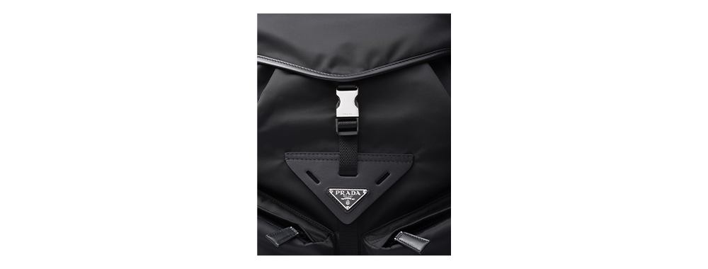 The Prada backpack is made of Re nylon and leather The Prada backpack is made of Re nylon and leather